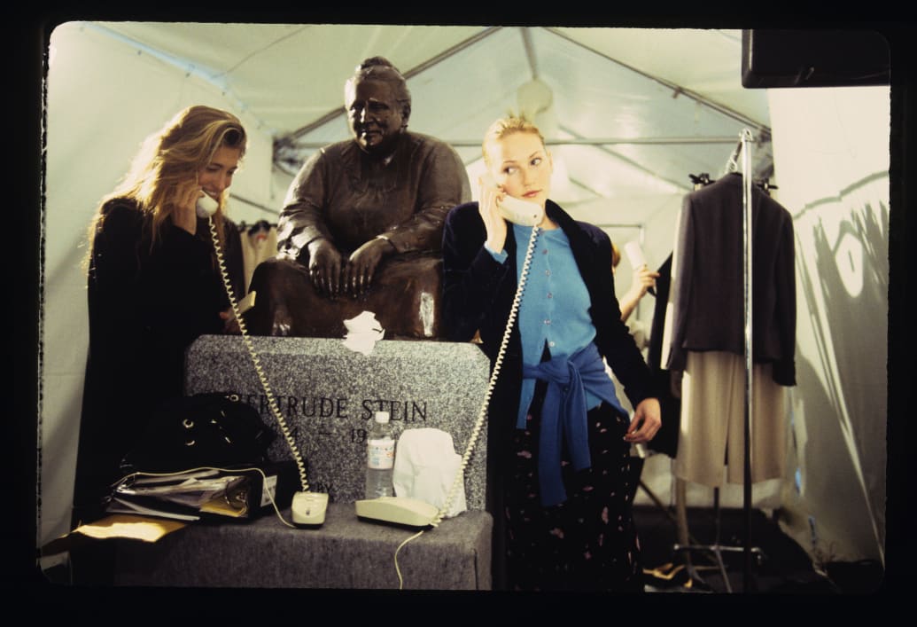 Carolyn Bessette-Kennedy (left) is pictured backstage at the Spring-Summer 1994 Calvin Klein runway show during New York Fashion Week on November 2, 1993.