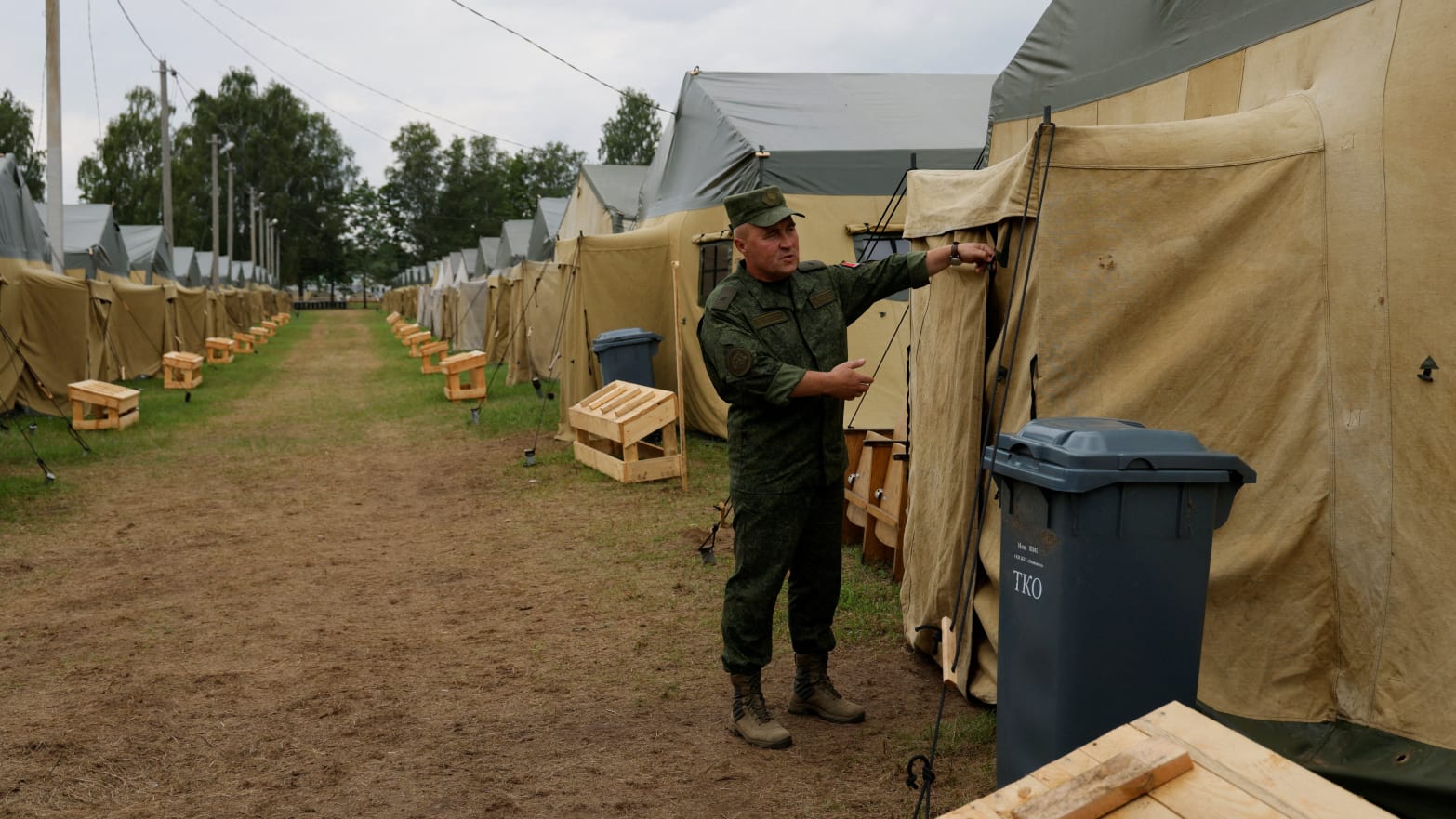 Major General Leonid Kasinsky shows off a tent at a camp near Tsel, Belarus, offered to Wagner fighters after the armed rebellion led by Yevgeny Prigozhin.