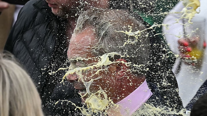 Nigel Farage is hit in the face with a milkshake while campaigning in Clacton. 