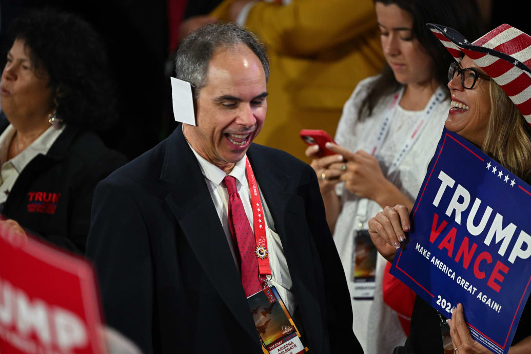 An Arizona delegate wears an envelope as a bandage.