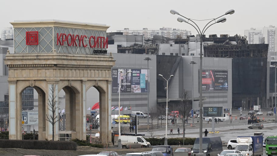 Cars drive past the Crocus City Hall in Moscow’s northern suburb of Krasnogorsk on March 29, 2024, a week after the deadliest attack in Europe to have been claimed by the Islamic State jihadist group that killed at least 143 people. 