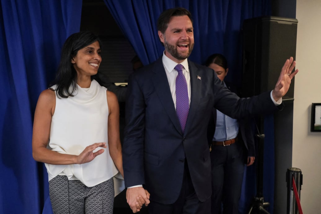 JD and Usha Vance hold hands at an event.