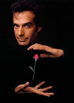gif of illusionist David Copperfield suspending various objects between his hands