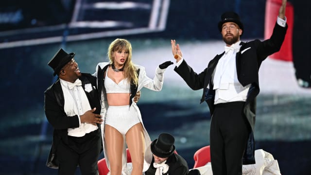 Taylor Swift and Travis Kelce on stage during her Eras Tour stop in London.