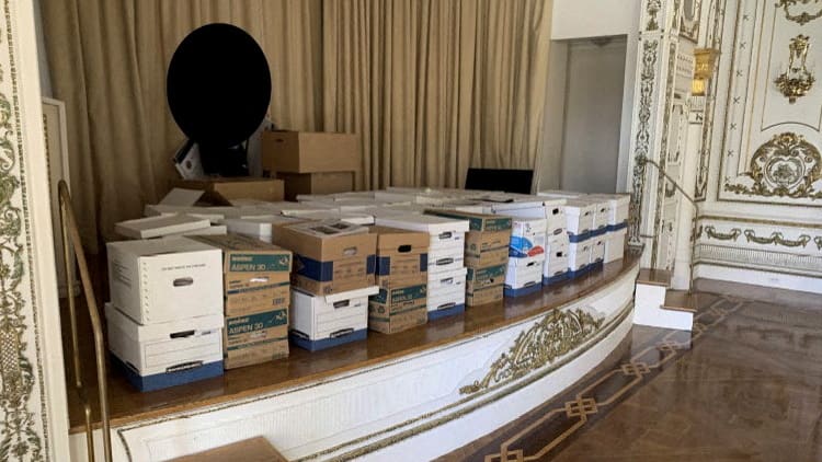 A photo of boxes of documents on a ballroom stage at Donald Trump's Mar-a-Lago resort.