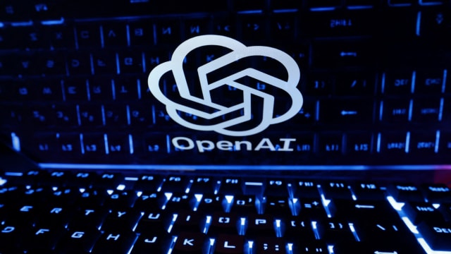 A keyboard is placed in front of a displayed OpenAI logo in this illustration taken February 21, 2023.