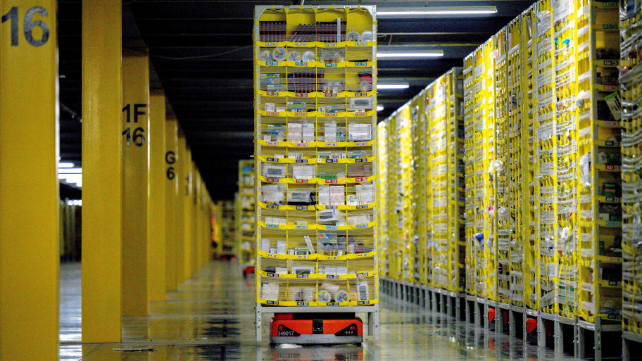A photo of robots transporting goods at an Amazon warehouse