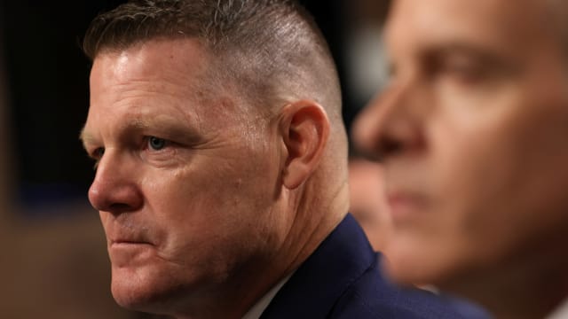 Ronald Rowe Jr. stares forward during a congressional hearing.