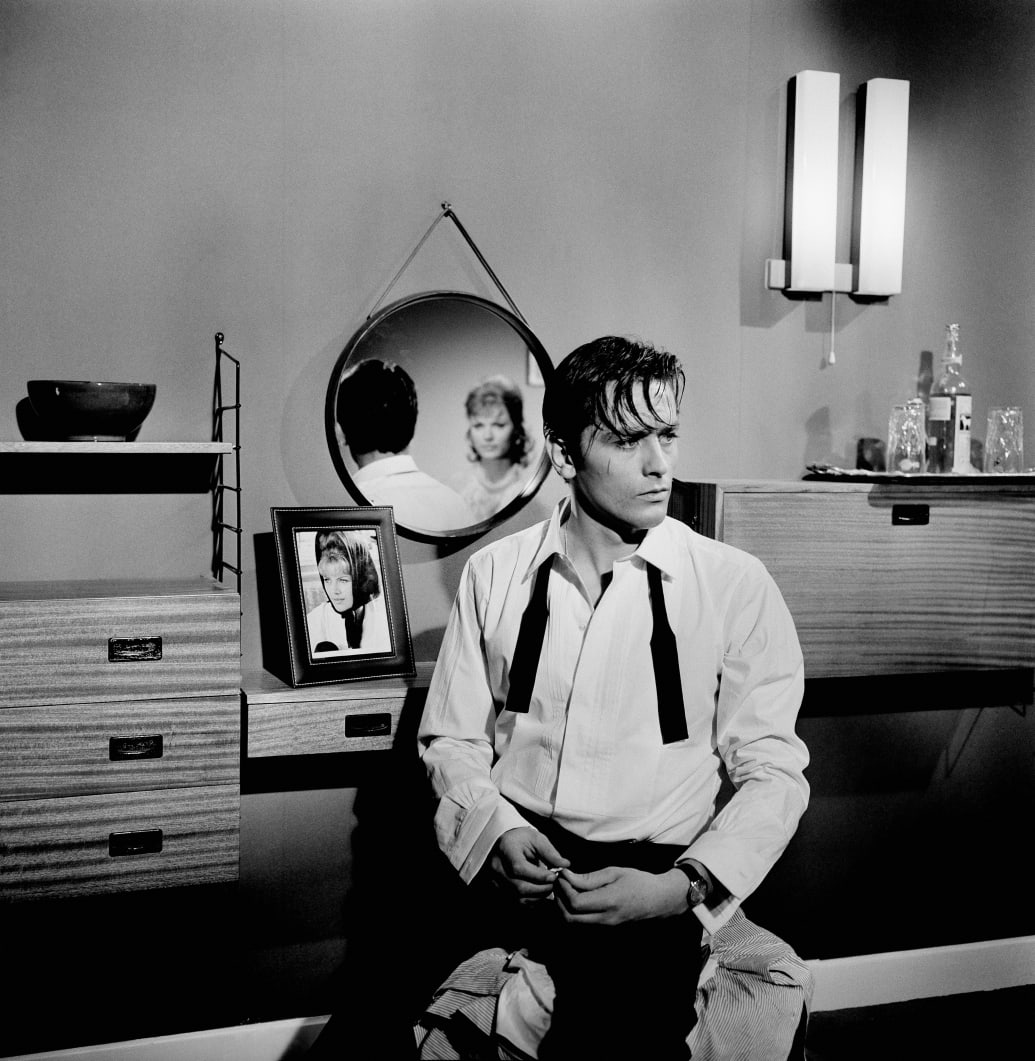 Alain Delon with his bowtie undone on the set of "Mélodie En Sous-Sol" in 1962