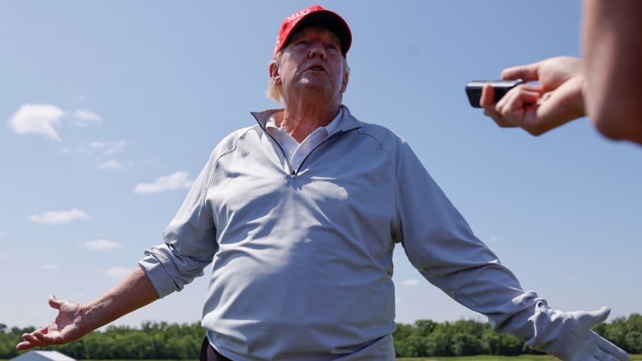 Former U.S. President Donald Trump talks with reporters as he participates in the Pro-Am tournament, ahead of the LIV Golf Invitational, at the Trump National Golf Club in Sterling, Virginia, U.S. May 25, 2023.