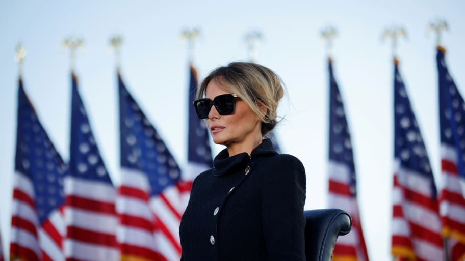 Melania Trump watches as then-President Donald Trump speaks at the Joint Base Andrews, Maryland, Jan. 20, 2021.