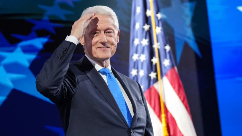 Former U.S. President Bill Clinton departs after speaking on stage during the third day of the Democratic National Convention in Chicago.