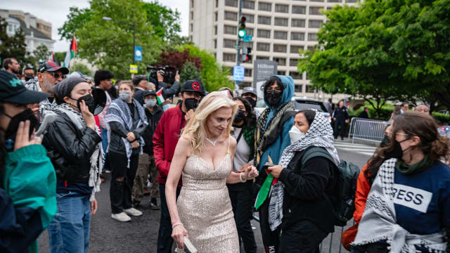 A guest is confronted by pro-Palestinian protestors demonstrate outside the White House Correspondents' Association (WHCA) dinner at the Washington Hilton, in Washington, DC, on April 27, 2024. 