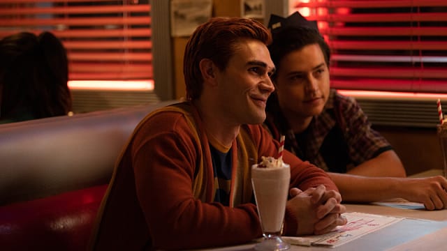Photo still of KJ Apa as Archie Andrews and Cole Sprouse as Jughead Jones in Riverdale