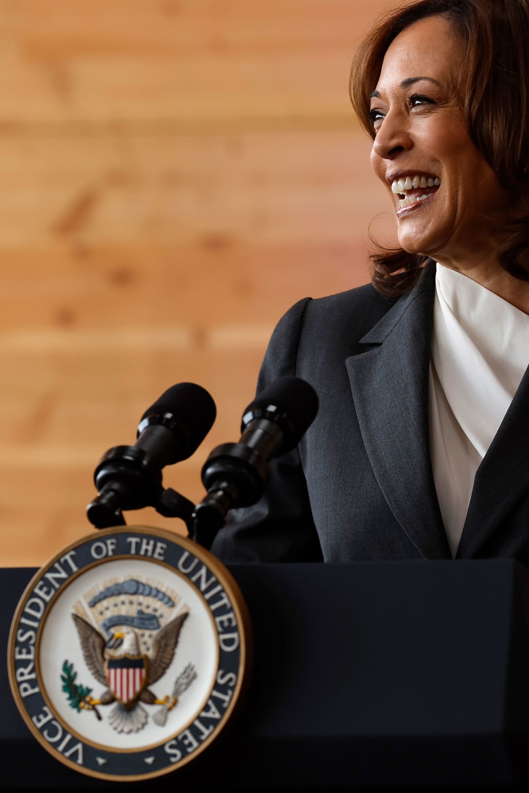 A picture of Kamala Harris delivering remarks at a pedestal. 