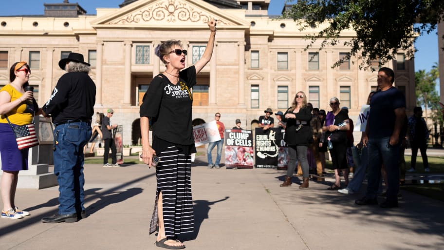 Anti-abortion activists demonstrate outside of the Arizona State Capitol.