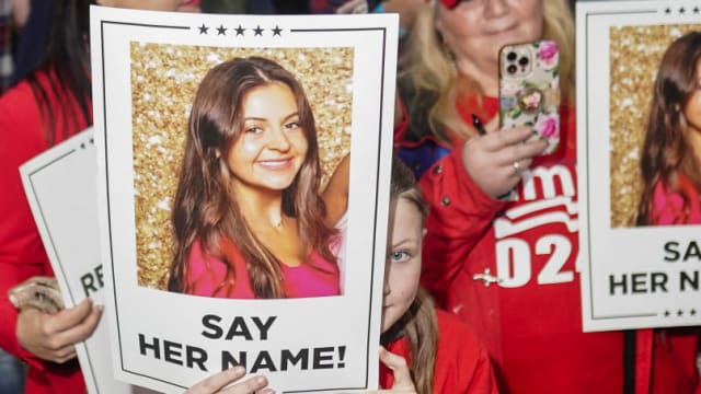Donald Trump supporters hold posters with a photo of Laken Riley that read, ‘Say Her Name.”
