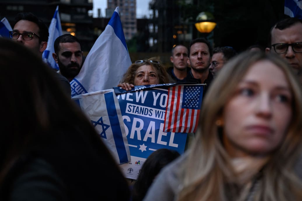 Photograph of a pro-Israel rally with a sign reading "New York stands with Israel"