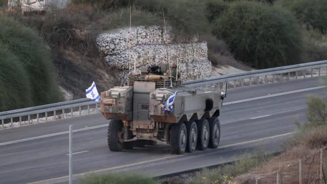 An Israeli tank heads toward the Gaza border. 