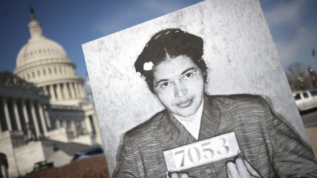 A booking photo of Rosa Parks is shown during a press conference with members of the Congressional Black Caucus outside the U.S. Capitol on Nov. 29, 2023, in Washington, D.C.