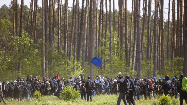 Police confront environmental activists in a forest near the Tesla Gigafactory electric car factory on May 10, 2024 near Gruenheide, Germany.