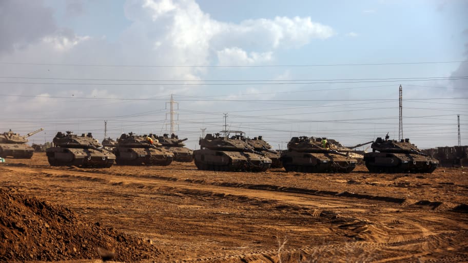 A formation of Israeli tanks is positioned near Israel's border with the Gaza Strip, in southern Israel October 15, 2023.