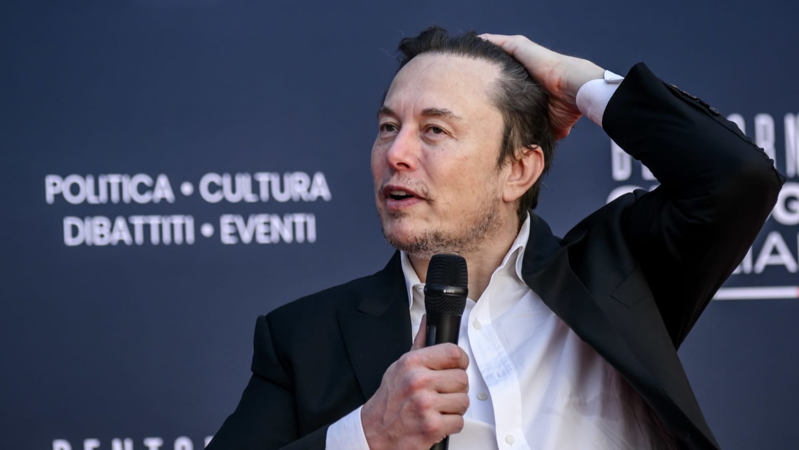Elon Musk speaks at a conference in Italy.