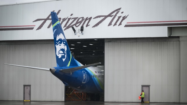 Alaska Airlines N704AL is seen grounded in a hangar at Portland International Airport. 