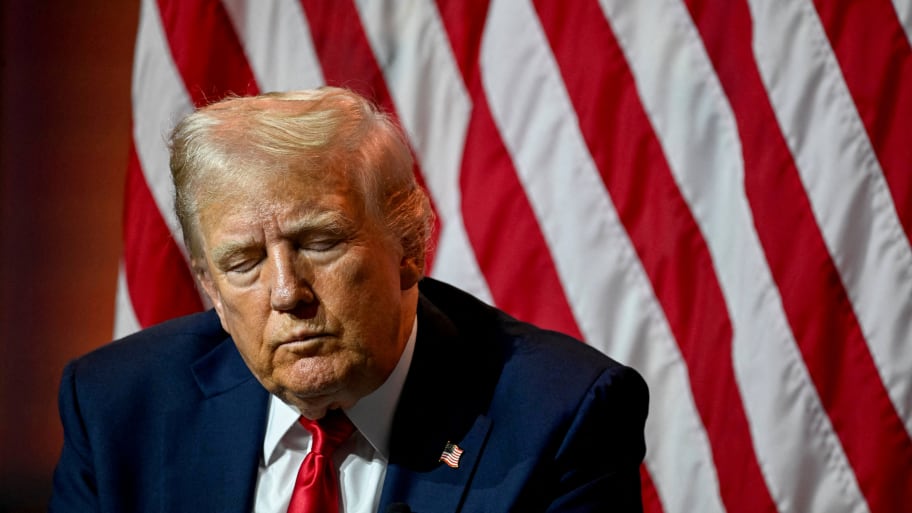 Donald Trump closes his eyes while on stage at the NABJ conference