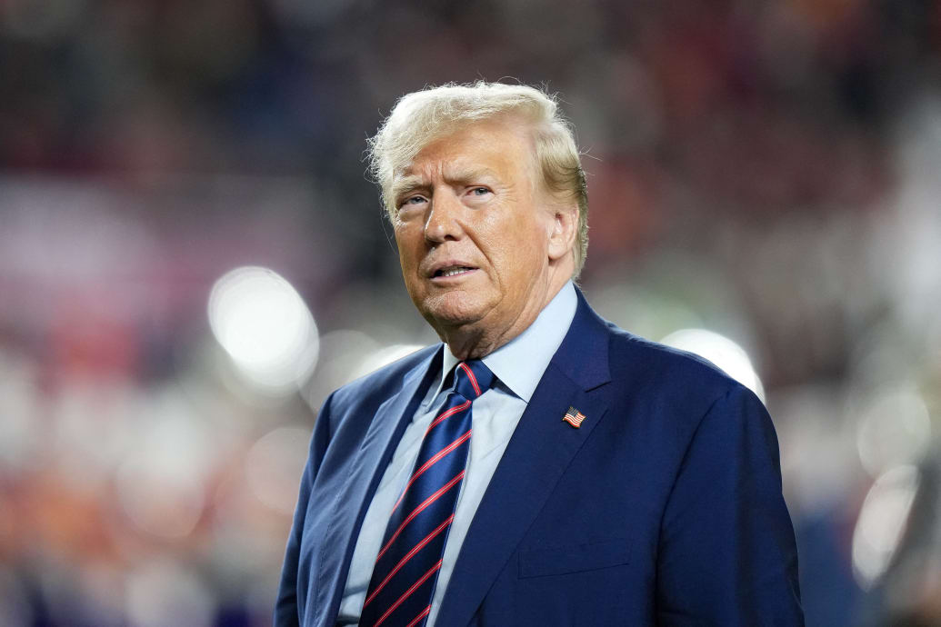 Former President Donald Trump looks on at half time of a game between the South Carolina Gamecocks and the Clemson Tigers.