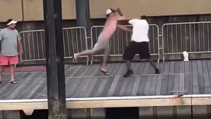Screenshot of video footage showing the beginning of a big brawl on a dock in Alabama.