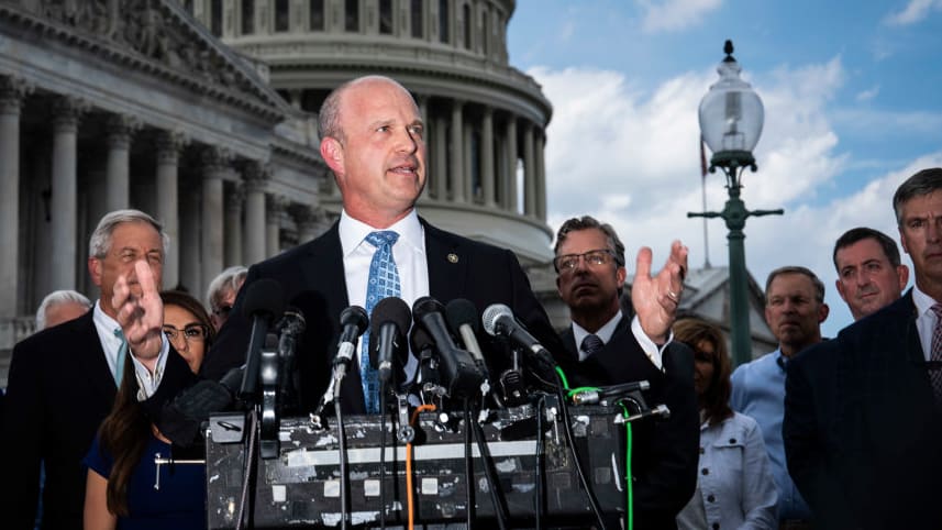 Kevin Roberts, president of The Heritage Foundation, speaks with members of the conservative House Freedom Caucus during a news conference on Capitol Hill.