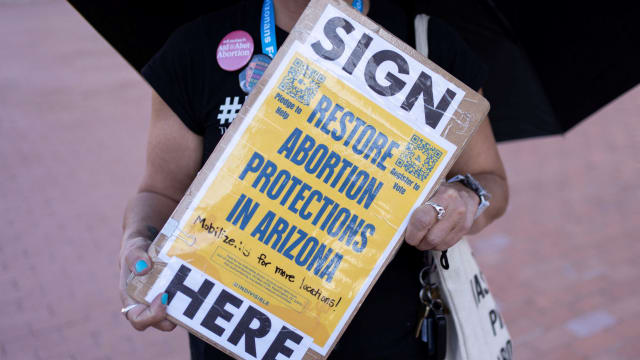 A pro-abortion protester holding a sign