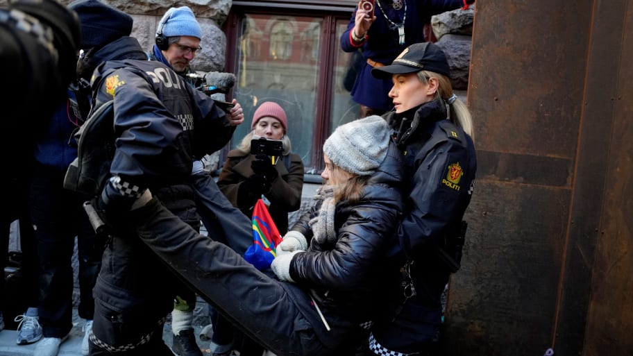 Greta Thunberg is carried away by police officers at a protest against the Fosen wind turbines not being demolished, which was built on land traditionally used by indigenous Sami reindeer herders, in Oslo, Norway, March 1, 2023. 