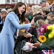 Kate Middleton smiles as she meets with people in Belfast.