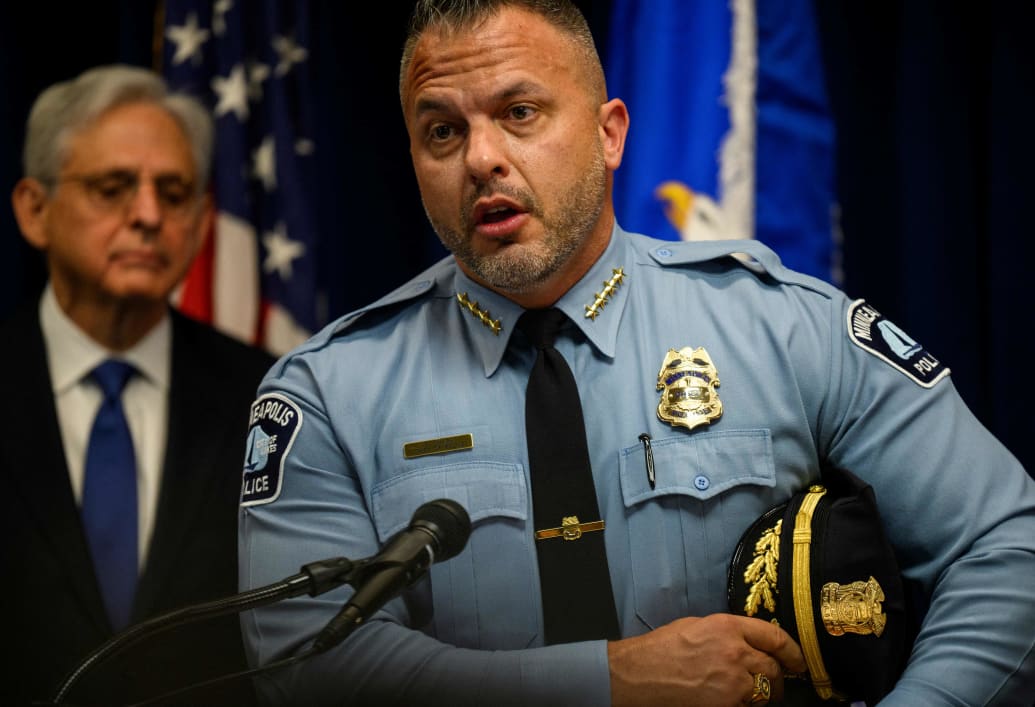 U.S. Attorney General Merrick B. Garland (L) looks on as Minneapolis Police Chief Brian O’Hara addresses the findings of a Justice Department investigation into the Minneapolis Police Department in June, 2023