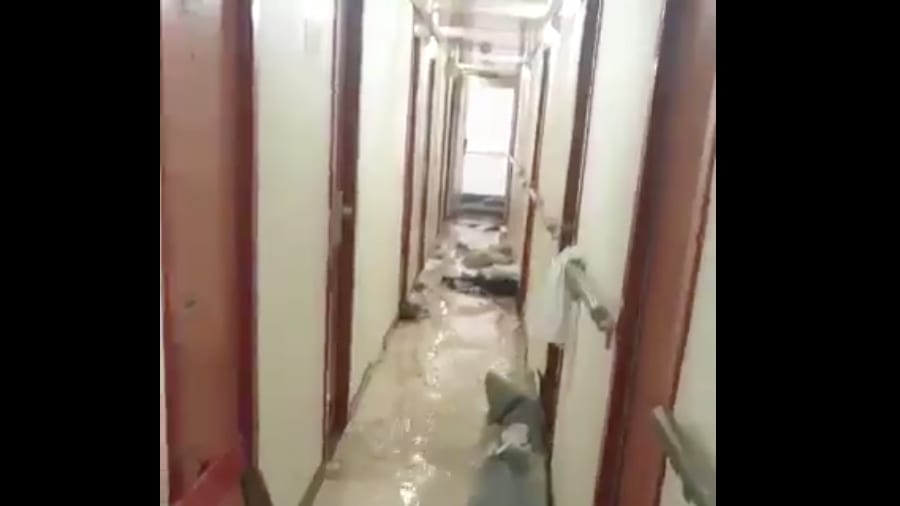 A flooded hallway on a Carnival cruise ship.