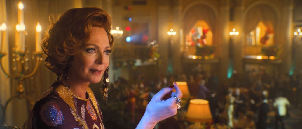 Allison Janney holds up a drink in a still from ‘Palm Royale’