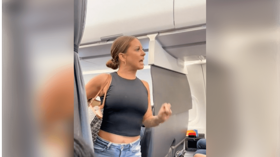 A picture of Tiffany Gomas from a viral video in which the 38-year-old marketing executive from Dallas exclaims “That motherfucker back there is not real!” on her American Airlines flight. She broke her silence to the Daily Mail.