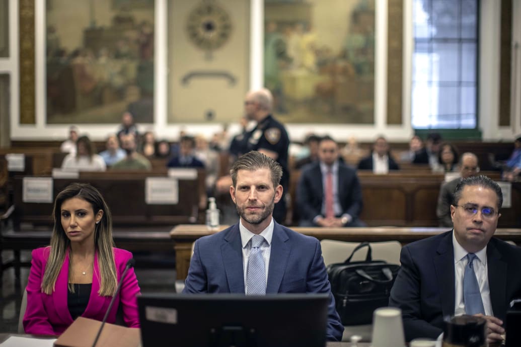 A photo including Eric Trump alongside his attorneys at New York State Supreme Court