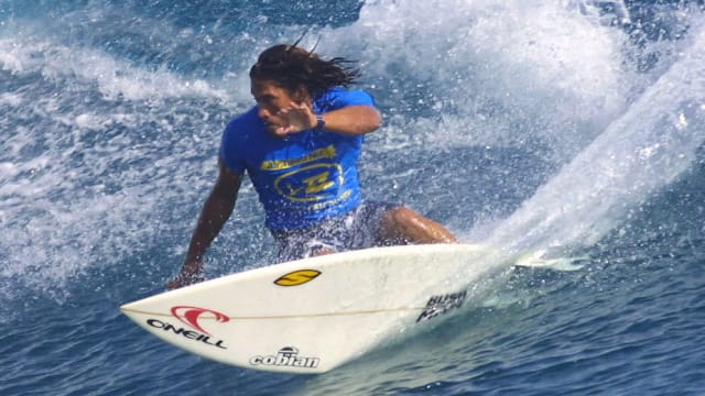 Tamayo Perry of Hawaii in action during a surf competition in 2003. 