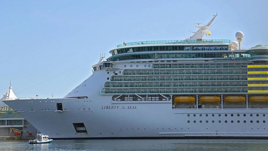 A side view of Liberty of the Seas as the cruise ship sits in port.