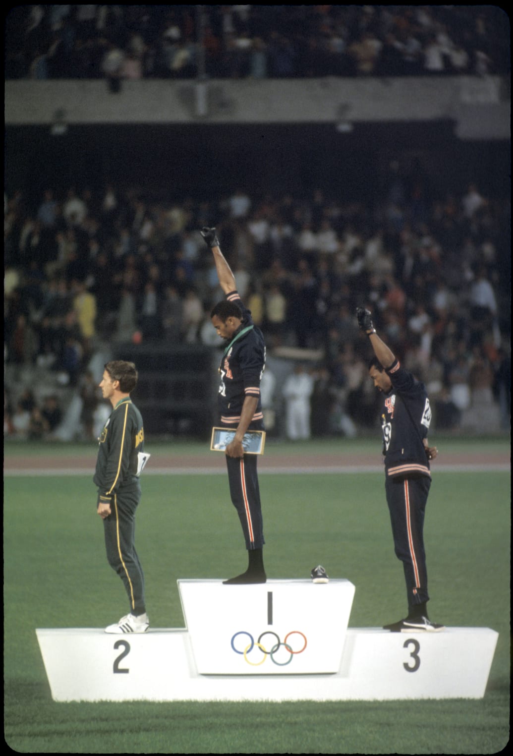 Tommie (1st place) and John Carlos (3rd place) of the U.S. raise their fists in the Black Power Salute during the playing of the national anthem at the Olympics in Mexico City, Mexico