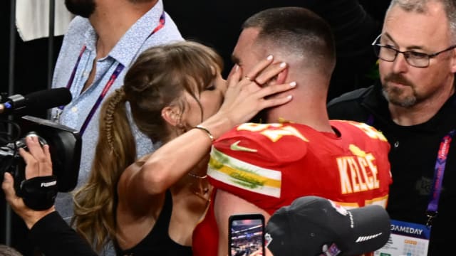 Taylor Swift kisses Travis Kelce following the Kansas City Chiefs’ Super Bowl LVIII win. 