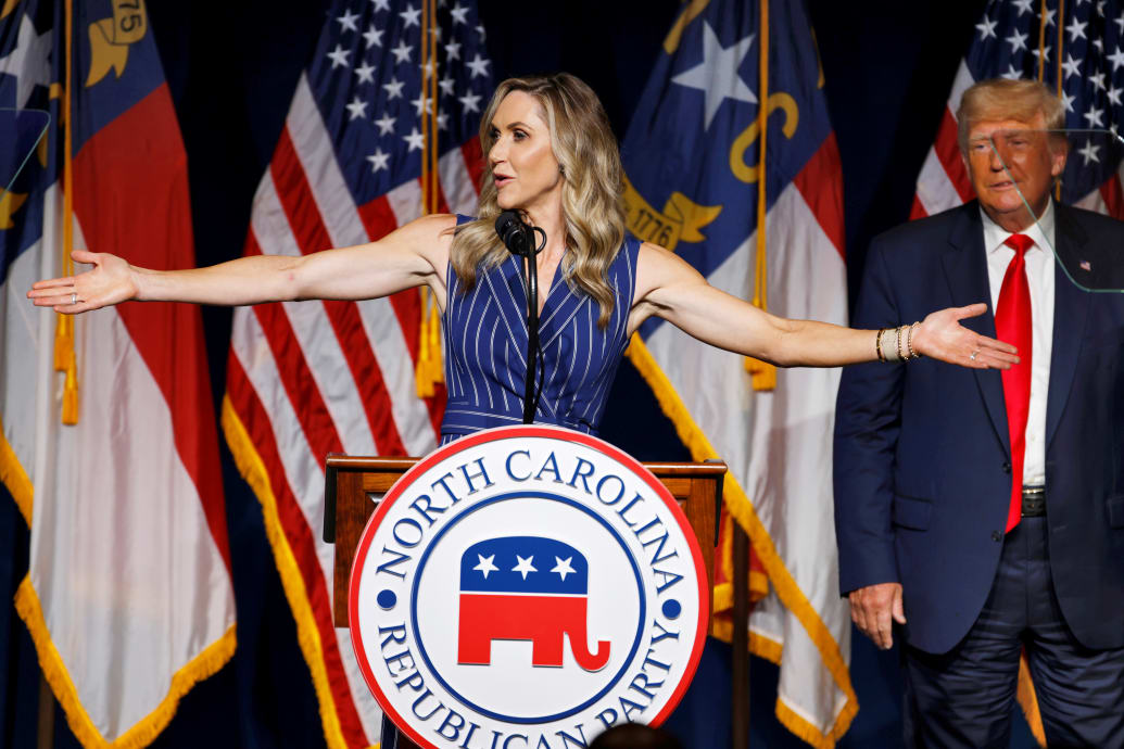 Lara Trump speaking n front of Donald Trump 