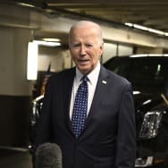 US President Joe Biden speaks to the press in the parking garage of the Fairmont Hotel in San Francisco, California, on February 22, 2024.