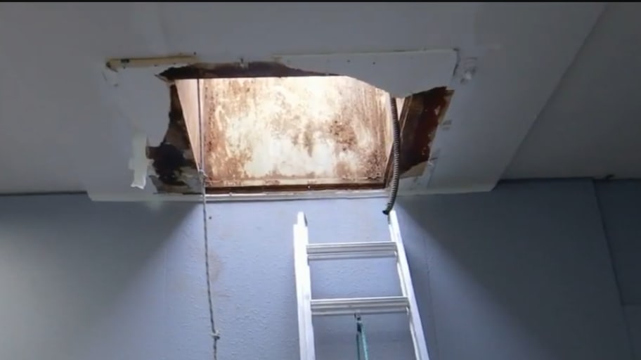A hole in the roof used by thieves to steal cars at Northtown Auto Sales in Spokane, Washington.