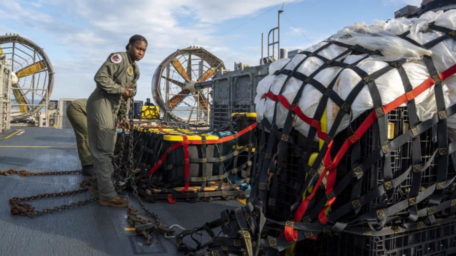 U.S. Navy personnel securing the remnants of a Chinese spy balloon.