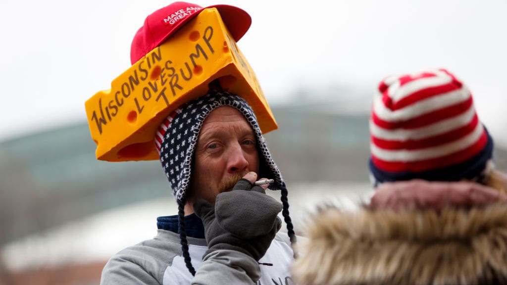 An attendee waits in line to attend a rally held by President Donald Trump.