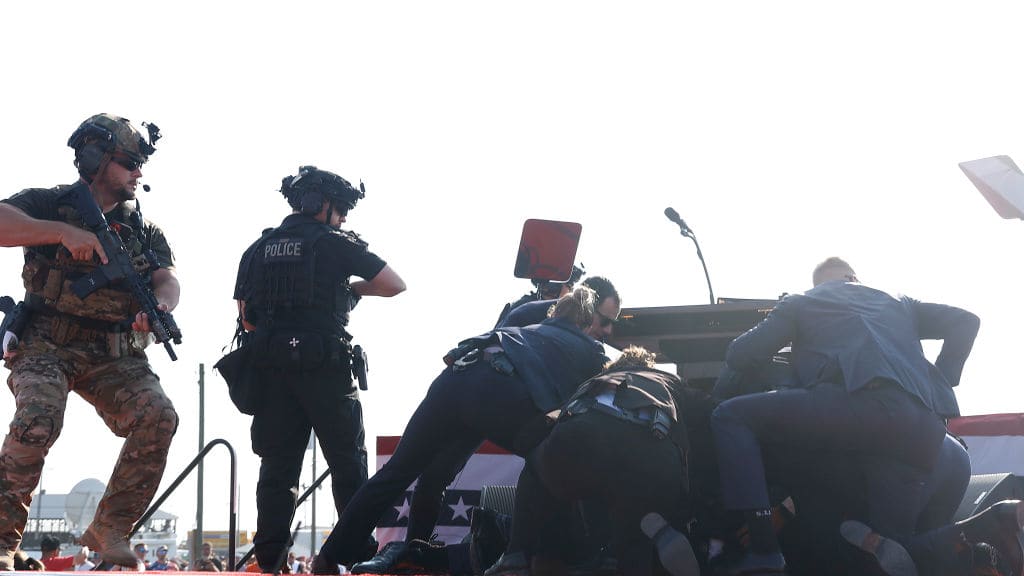 Republican presidential candidate former President Donald Trump is rushed offstage during a rally on July 13, 2024 in Butler, Pennsylvania. 